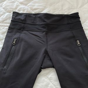 Lululemon black leggings with sheer fabric at ankle